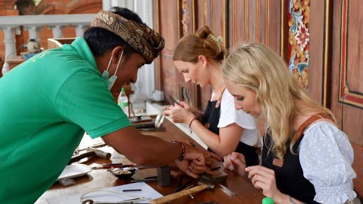 Silversmith crafting Balinese jewellery at traditional workshop Ubud