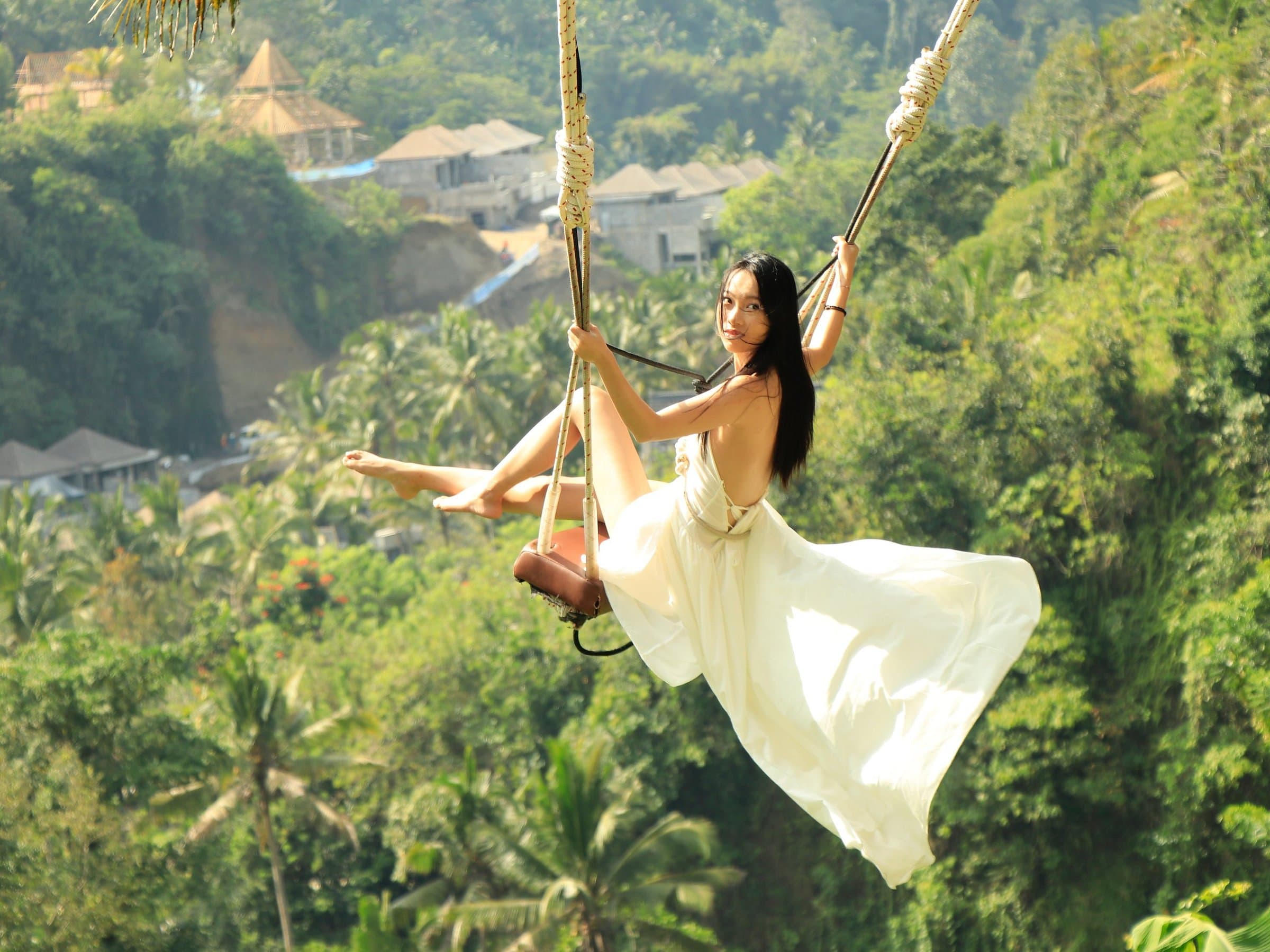Giant jungle swing overlooking Tegallalang rice terraces in Ubud Bali